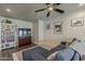 Comfortable living room with a sofa, decorative shelving, and a ceiling fan at 1422 E Windsor Ave, Phoenix, AZ 85006