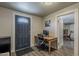 Home office features a wooden desk and modern door at 1422 E Windsor Ave, Phoenix, AZ 85006