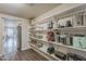 Organized pantry with open shelving providing ample storage space at 1422 E Windsor Ave, Phoenix, AZ 85006