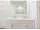 Bright bathroom with a double vanity and large mirror at 35445 N Seedling St, San Tan Valley, AZ 85144