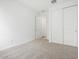 This bedroom is bright and airy with neutral carpet and white trim at 35445 N Seedling St, San Tan Valley, AZ 85144
