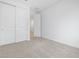 Bright bedroom with carpeted floors and sliding-door closet at 35445 N Seedling St, San Tan Valley, AZ 85144
