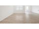Inviting living room features tile flooring, natural light, and neutral-colored walls at 35445 N Seedling St, San Tan Valley, AZ 85144