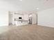 Open-concept with tile floor, recessed lights, and island kitchen featuring a breakfast bar at 35445 N Seedling St, San Tan Valley, AZ 85144
