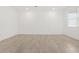 Large room boasts recessed lighting, large windows, and neutral tile flooring at 35445 N Seedling St, San Tan Valley, AZ 85144