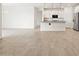 Expansive space features tile flooring and connects seamlessly to the kitchen at 35445 N Seedling St, San Tan Valley, AZ 85144