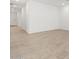 Spacious living room showcasing tile flooring and a neutral color palette at 35445 N Seedling St, San Tan Valley, AZ 85144