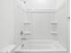 Clean, white bathtub with shower featuring a white shower-tub combo at 35445 N Seedling St, San Tan Valley, AZ 85144