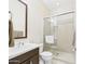 Neutral bathroom featuring a vanity and glass enclosed shower with white tile at 4571 S Pinaleno W Dr, Chandler, AZ 85249