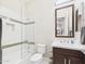 Modern bathroom featuring a vanity, a soaking tub with shower and neutral accents at 4571 S Pinaleno W Dr, Chandler, AZ 85249