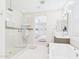 Light and airy bathroom featuring a glass shower, soaking tub, and stylish vanity at 4571 S Pinaleno W Dr, Chandler, AZ 85249