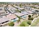 An aerial view of homes with sparkling pools, well-kept landscaping, and community walking paths at 4571 S Pinaleno W Dr, Chandler, AZ 85249