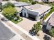 This home has beautiful landscaping, a circular driveway and an attached garage at 4571 S Pinaleno W Dr, Chandler, AZ 85249