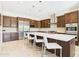 Gourmet kitchen features a large island, stainless steel appliances, and custom cabinetry at 4571 S Pinaleno W Dr, Chandler, AZ 85249
