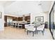 Spacious kitchen featuring an island with seating, pendant lights, and an adjacent dining area at 4571 S Pinaleno W Dr, Chandler, AZ 85249