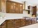 Well-equipped kitchen with custom cabinetry, stainless steel appliances, and modern countertops at 4571 S Pinaleno W Dr, Chandler, AZ 85249