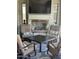 Cozy outdoor living area with fireplace, comfortable chairs, and stylish decor at 4571 S Pinaleno W Dr, Chandler, AZ 85249