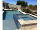 Resort-style backyard with pool, spa, lounge chairs, and outdoor pergola at 4571 S Pinaleno W Dr, Chandler, AZ 85249