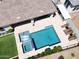 Aerial view of a backyard pool with spa, lounge chairs and meticulous landscaping at 4571 S Pinaleno W Dr, Chandler, AZ 85249