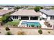This home features a beautiful swimming pool with a spa, a covered patio and landscaping at 4571 S Pinaleno W Dr, Chandler, AZ 85249