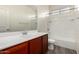 Bathroom featuring a single vanity and tub/shower combo with white tile at 5750 S 250Th Dr, Buckeye, AZ 85326