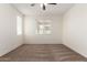 Well-lit bedroom with neutral carpet, a large window and neutral walls at 5750 S 250Th Dr, Buckeye, AZ 85326