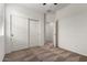 Carpeted bedroom with an ensuite bathroom and closet at 5750 S 250Th Dr, Buckeye, AZ 85326
