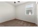 Carpeted bedroom with ceiling fan and bright window at 5750 S 250Th Dr, Buckeye, AZ 85326