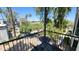 Outdoor balcony with chairs offers relaxing views of trees and surrounding landscape at 740 W Elm St # 264, Phoenix, AZ 85013