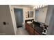 Bathroom featuring a shower-tub combo and double sink vanity with storage at 740 W Elm St # 264, Phoenix, AZ 85013