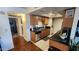 Galley kitchen with dark granite countertops, a breakfast bar, stainless appliances, and access to a bedroom at 740 W Elm St # 264, Phoenix, AZ 85013