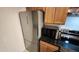 Kitchen features stainless steel refrigerator, microwave, and electric range at 740 W Elm St # 264, Phoenix, AZ 85013