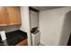 A laundry area features a stacked washer and dryer, maximizing space at 740 W Elm St # 264, Phoenix, AZ 85013