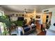 Spacious living room with lots of wall art, a ceiling fan, wood floors, and plenty of sunlight at 740 W Elm St # 264, Phoenix, AZ 85013