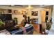 A cozy living room with hardwood floors, bright walls, and a shelf filled with wall art at 740 W Elm St # 264, Phoenix, AZ 85013