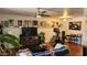 Spacious living room with lots of wall art, wood floors, a ceiling fan, and lots of light at 740 W Elm St # 264, Phoenix, AZ 85013