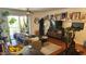 Open living room with lots of art, hardwood floors, and direct view from kitchen and balcony at 740 W Elm St # 264, Phoenix, AZ 85013
