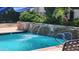 Relaxing pool with rock waterfall feature and plenty of lounge seating at 740 W Elm St # 264, Phoenix, AZ 85013
