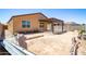 Backyard features a covered patio with pergola and a cinderblock fence at 12474 W Glenn Ct, Glendale, AZ 85307