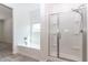 Bright bathroom with a soaking tub and a sliding glass shower at 12474 W Glenn Ct, Glendale, AZ 85307