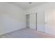 Bedroom showcasing carpet, closet, neutral paint, and a window at 12474 W Glenn Ct, Glendale, AZ 85307