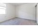 Bedroom with a window and a closet, featuring neutral walls and carpet at 12474 W Glenn Ct, Glendale, AZ 85307