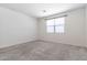 Neutral bedroom with carpet, a window, and blank walls at 12474 W Glenn Ct, Glendale, AZ 85307