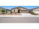 Charming single-story home featuring a two-car garage and low-maintenance desert landscaping at 12474 W Glenn Ct, Glendale, AZ 85307