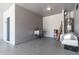 Functional garage with a utility sink, epoxy floors, and ample storage space at 12474 W Glenn Ct, Glendale, AZ 85307
