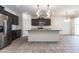 Modern kitchen with stainless steel appliances and a large island at 12474 W Glenn Ct, Glendale, AZ 85307