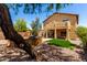 Large backyard with an outdoor kitchen, patio, synthetic lawn, and desert landscaping at 12957 W Scotts Dr, El Mirage, AZ 85335