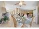 Open dining room with tile floors and views into kitchen and living room at 14999 W Mulberry Dr, Goodyear, AZ 85395