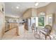 Open kitchen with stainless steel appliances, island, and plenty of sunlight at 14999 W Mulberry Dr, Goodyear, AZ 85395