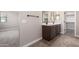 Bathroom featuring double sink vanity and mirror at 15622 S 181St Dr, Goodyear, AZ 85338